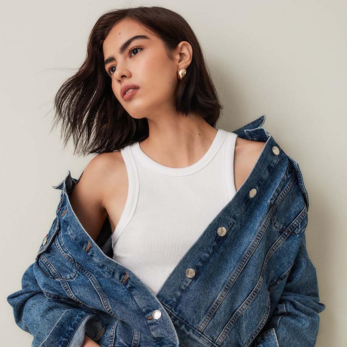 beautiful girl wearing blue denim jacket and white shirt 