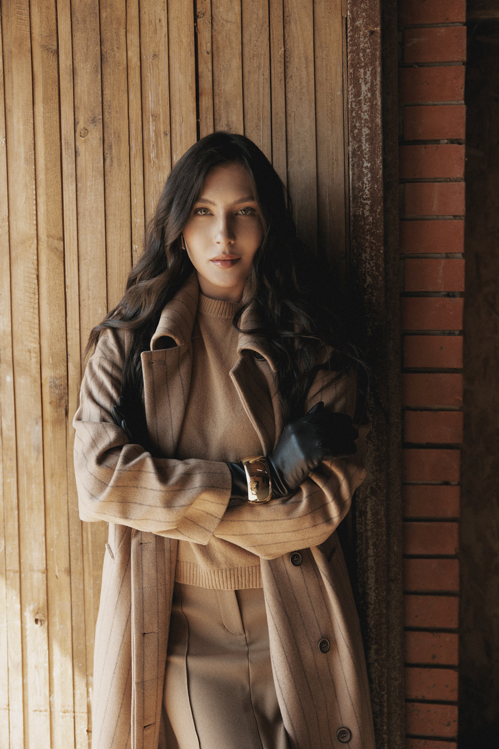 beautiful women wearing a long brown coat jacket 