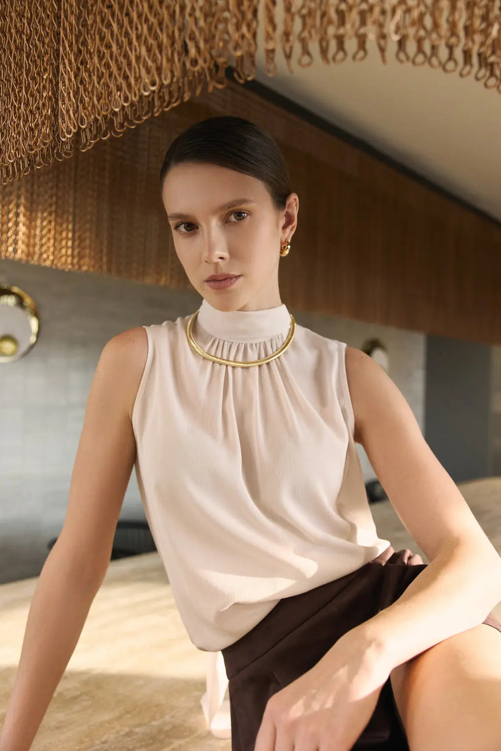 BEAUTIFUL YOUNG BOLD WOMAN WEARING BEIGE SHIRT