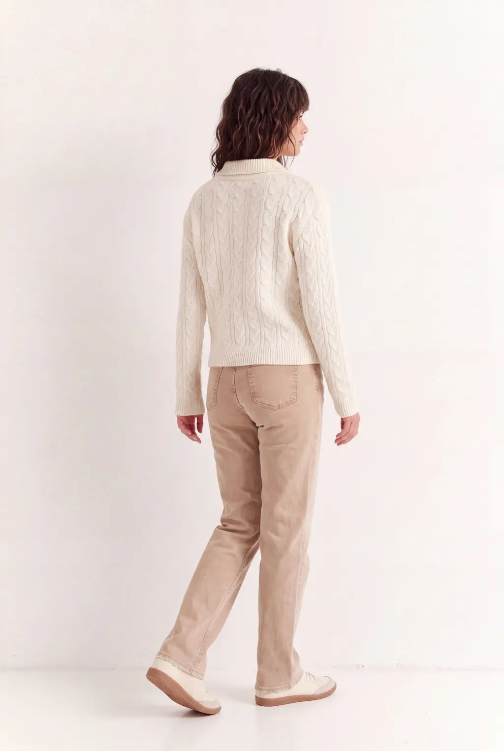 Woman wearing luxury ivory cotton polo jumper styled with tailored trousers - AYRA Store quiet luxury knitwear