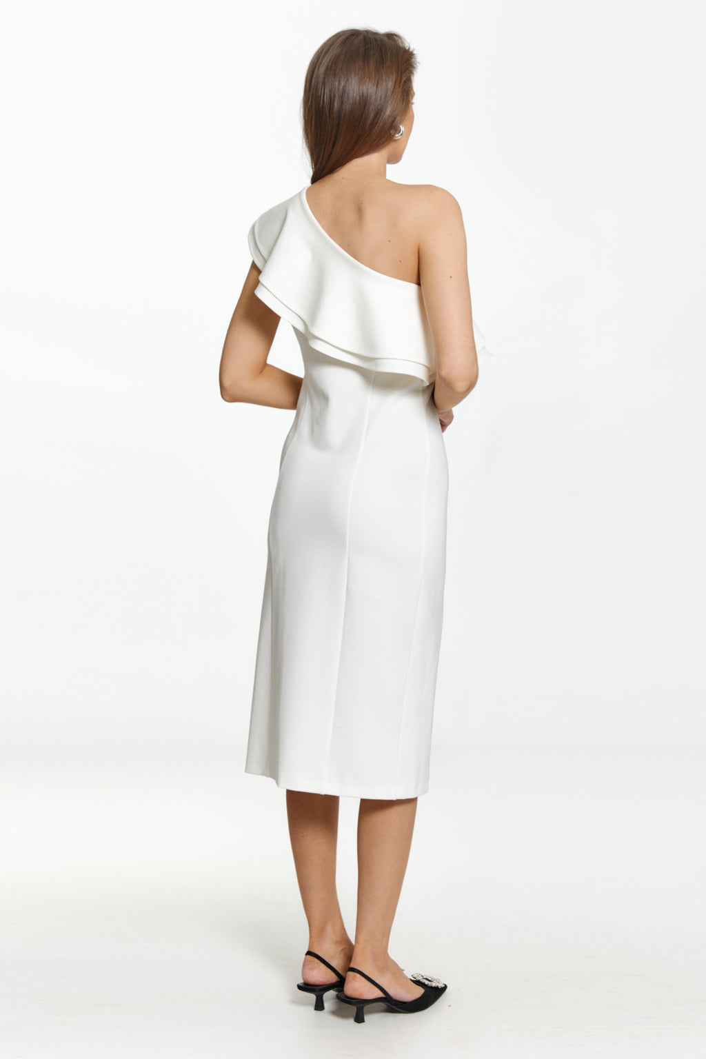 Woman wearing a white one-shoulder dress on a white background