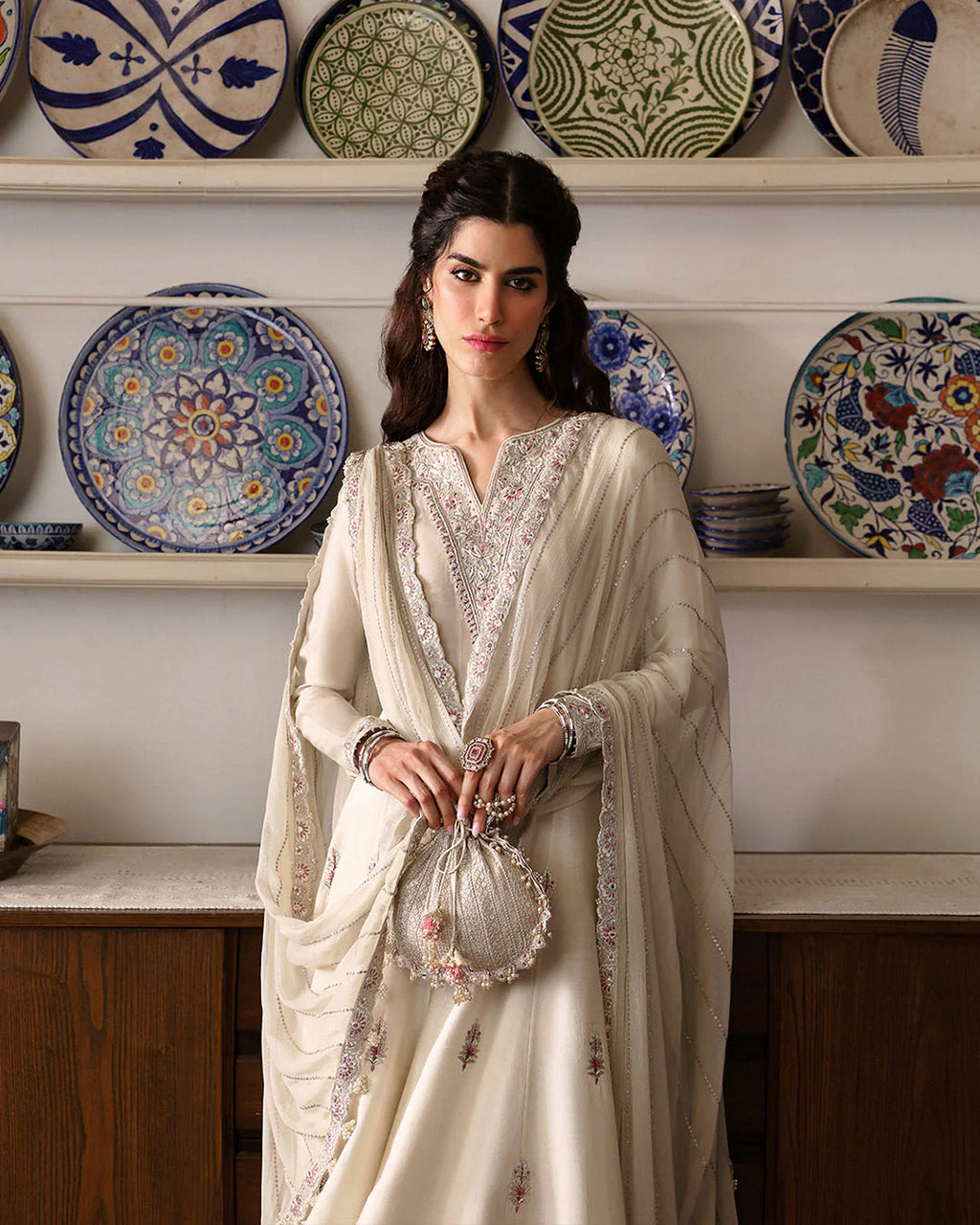 sabina-refined-ivory-festive-ensemble-with-intricate-neckline-and-potli-bag-ayra