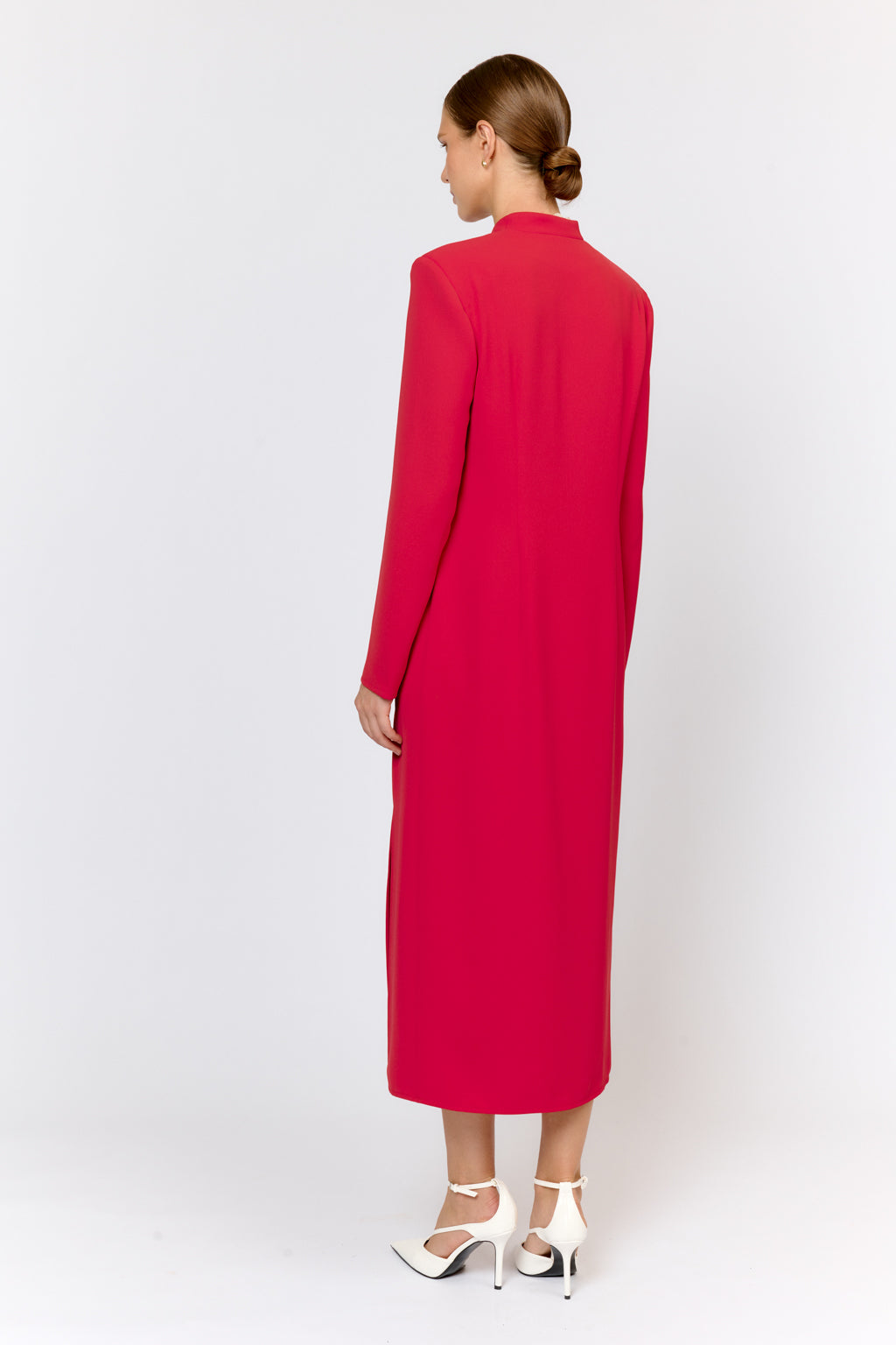 Woman wearing a red dress on a white background