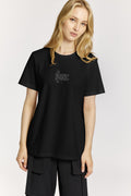 Person wearing a black t-shirt with a logo on a white background