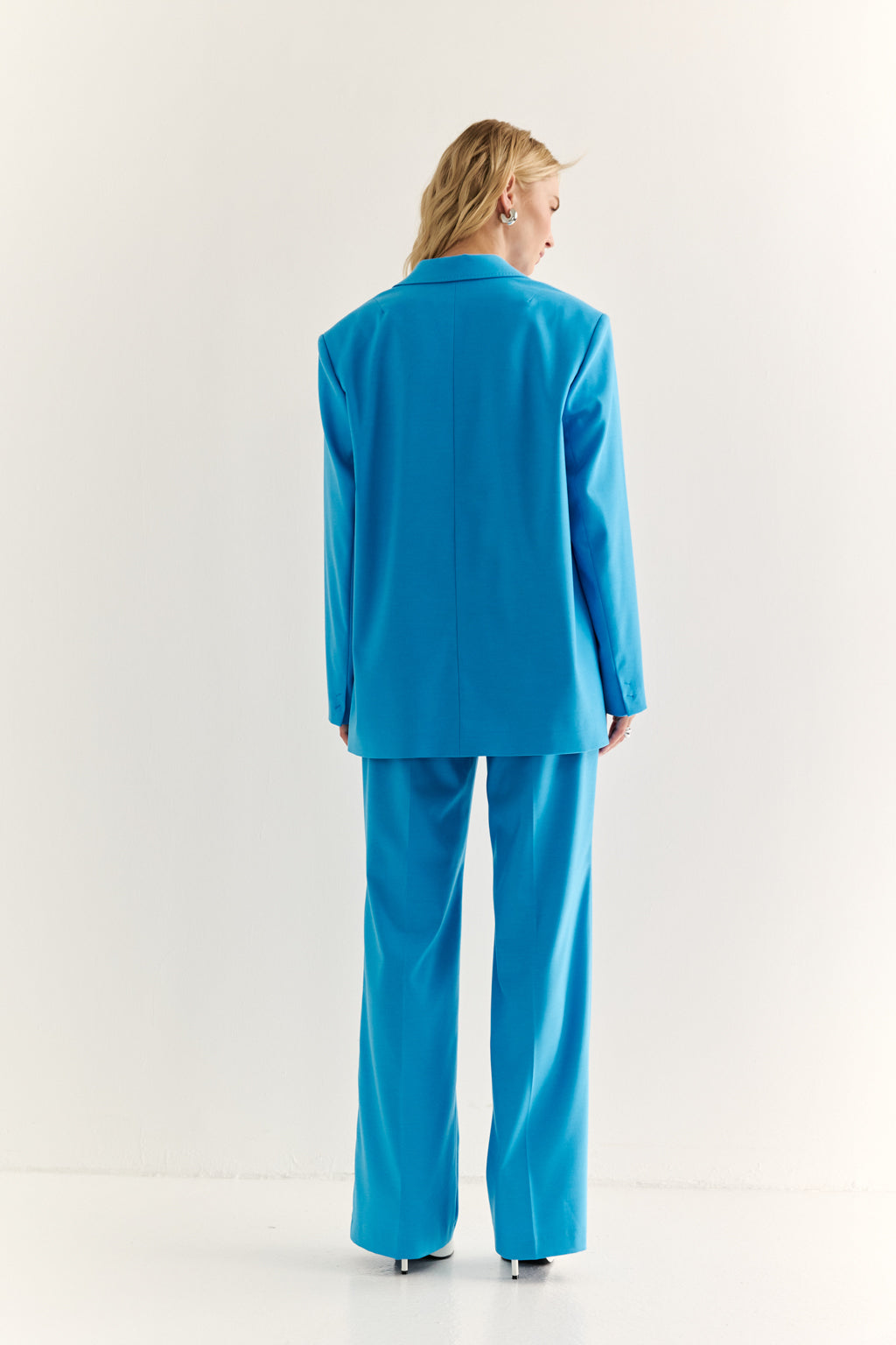 Person wearing a blue suit on a white background
