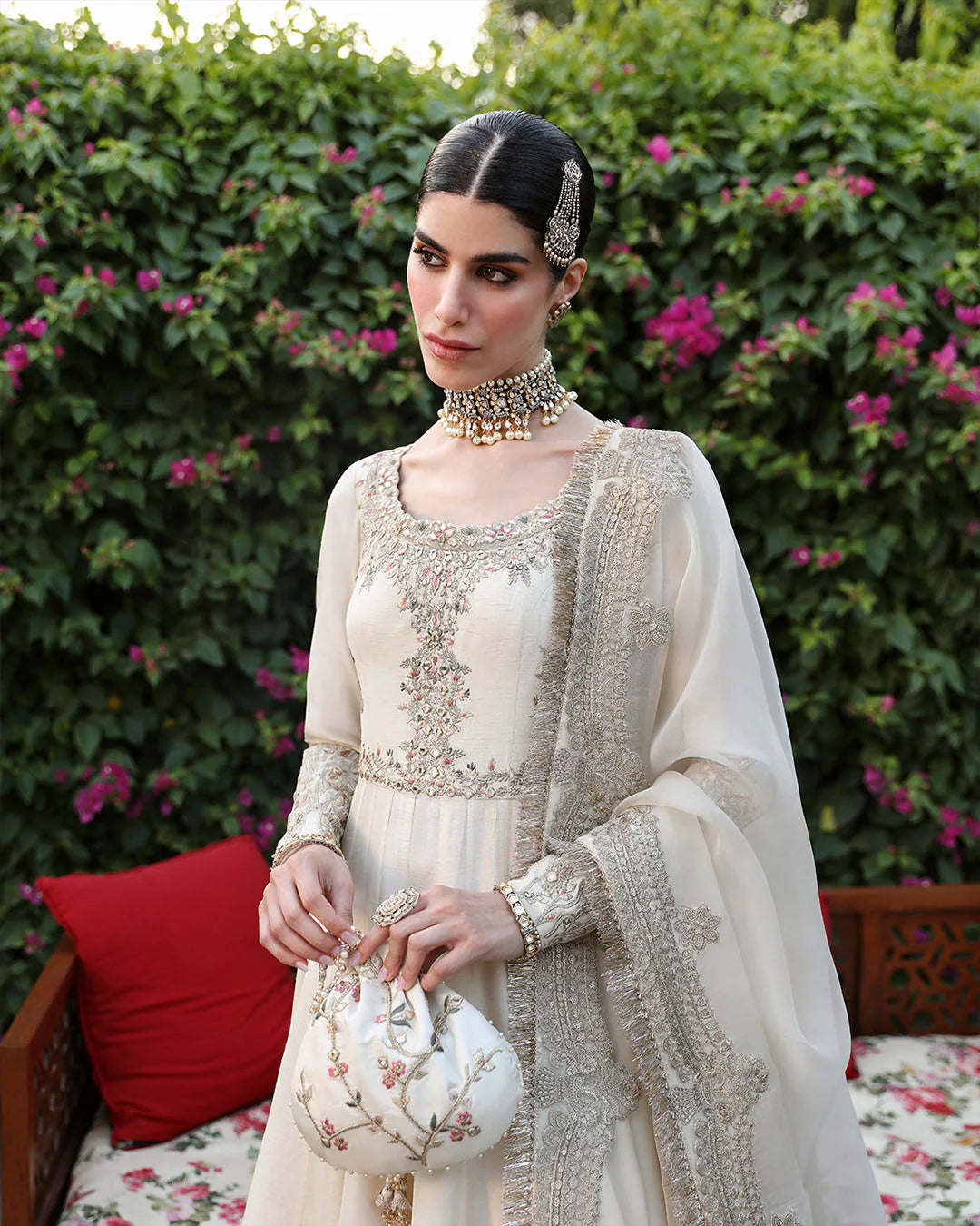 Woman in traditional outfit with floral background
