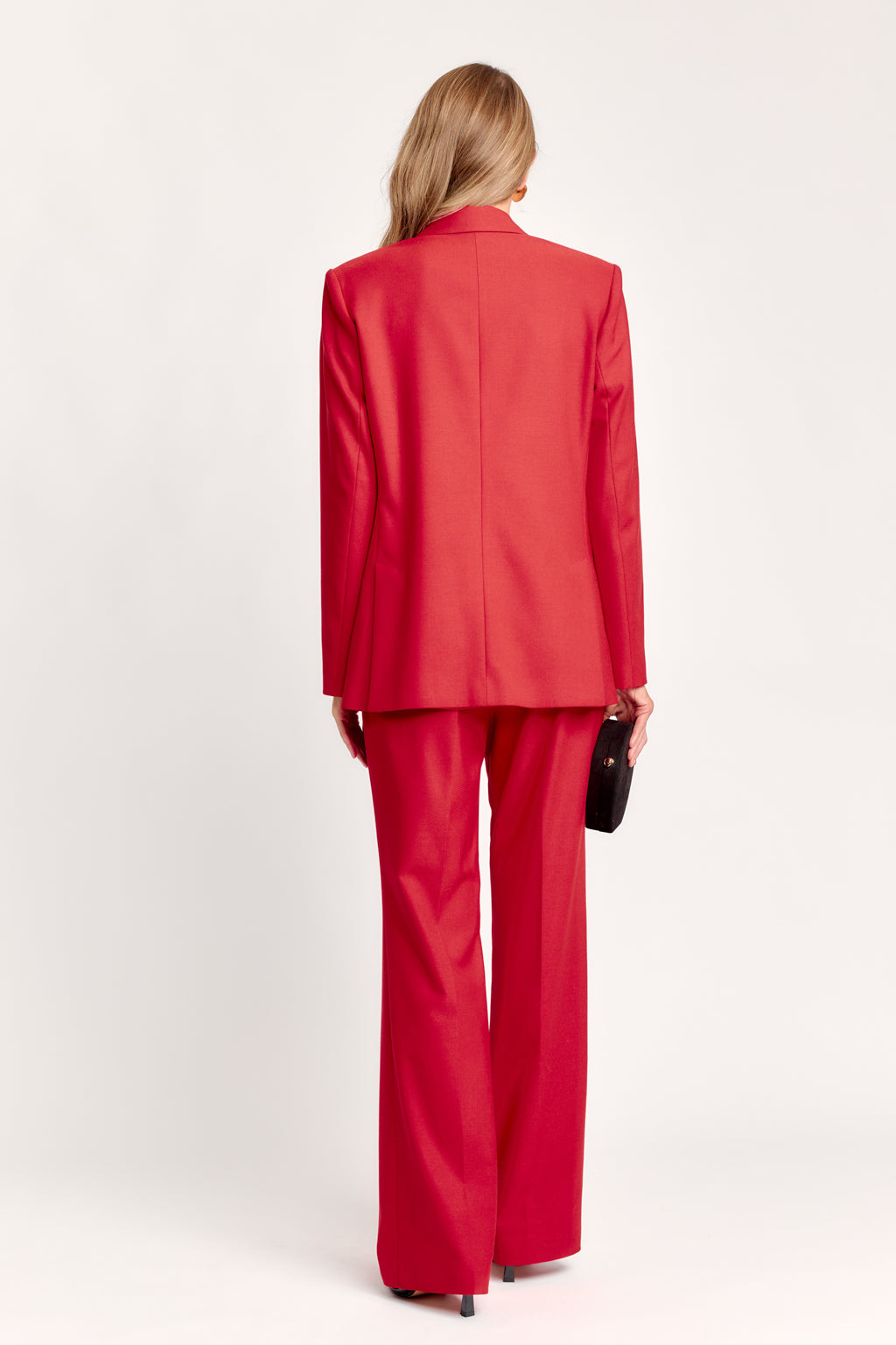 Person wearing a red suit on a white background