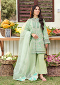 Woman in a light green traditional outfit standing in front of a market stall with fruits and vegetables.