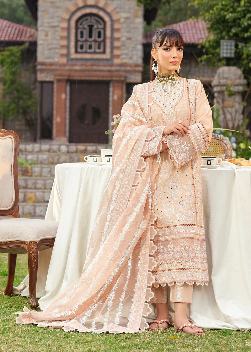 Woman in a traditional outfit standing outdoors with a decorated table and building in the background