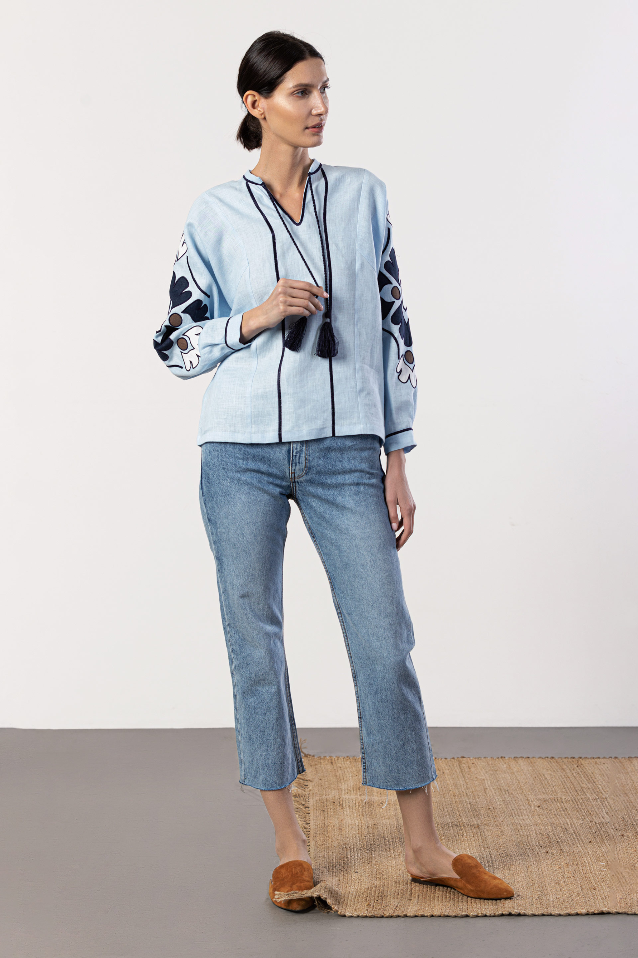 Beautiful Model wearing light blue embroidered women shirt