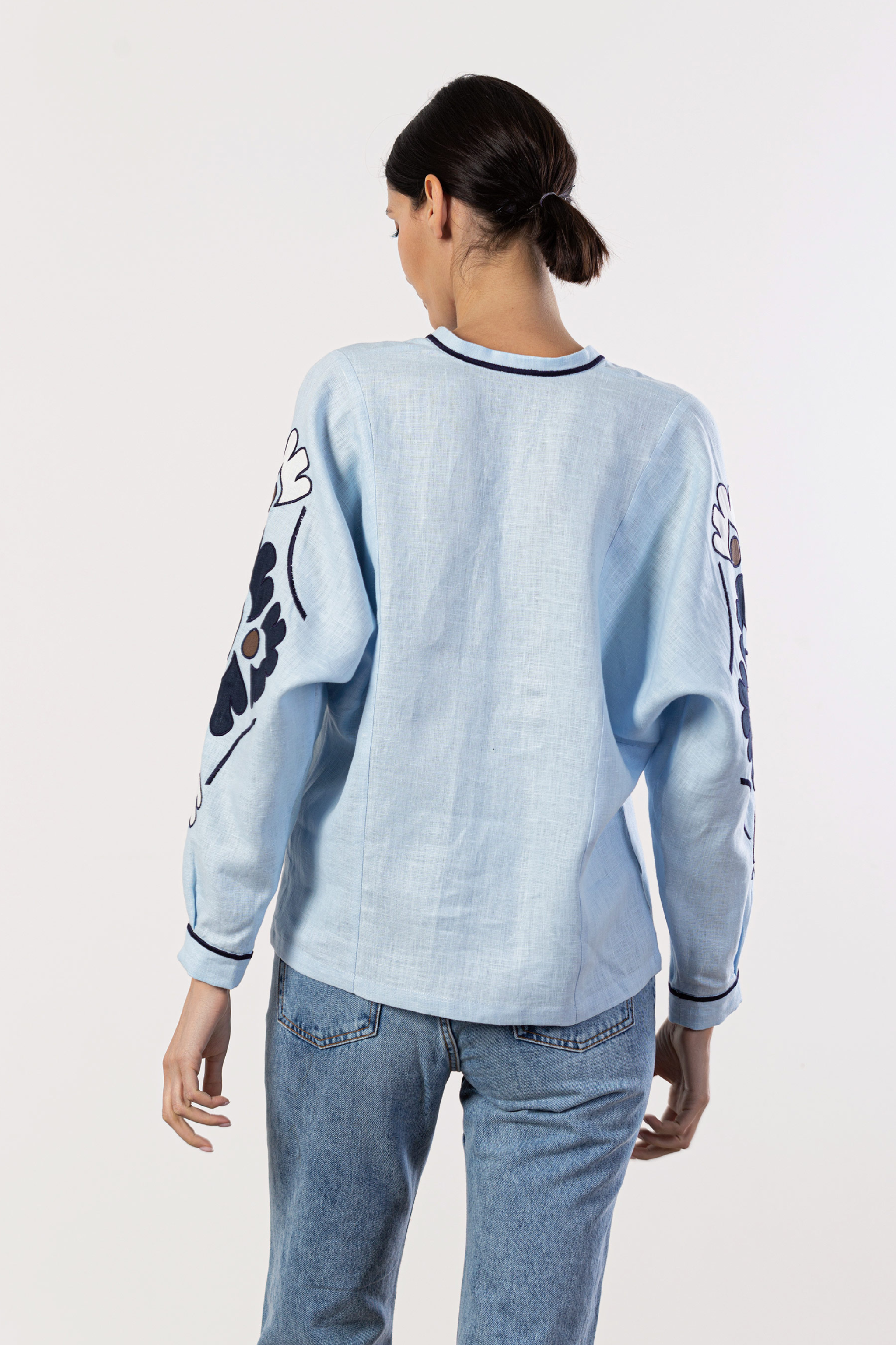 Beautiful Model wearing light blue embroidered women shirt