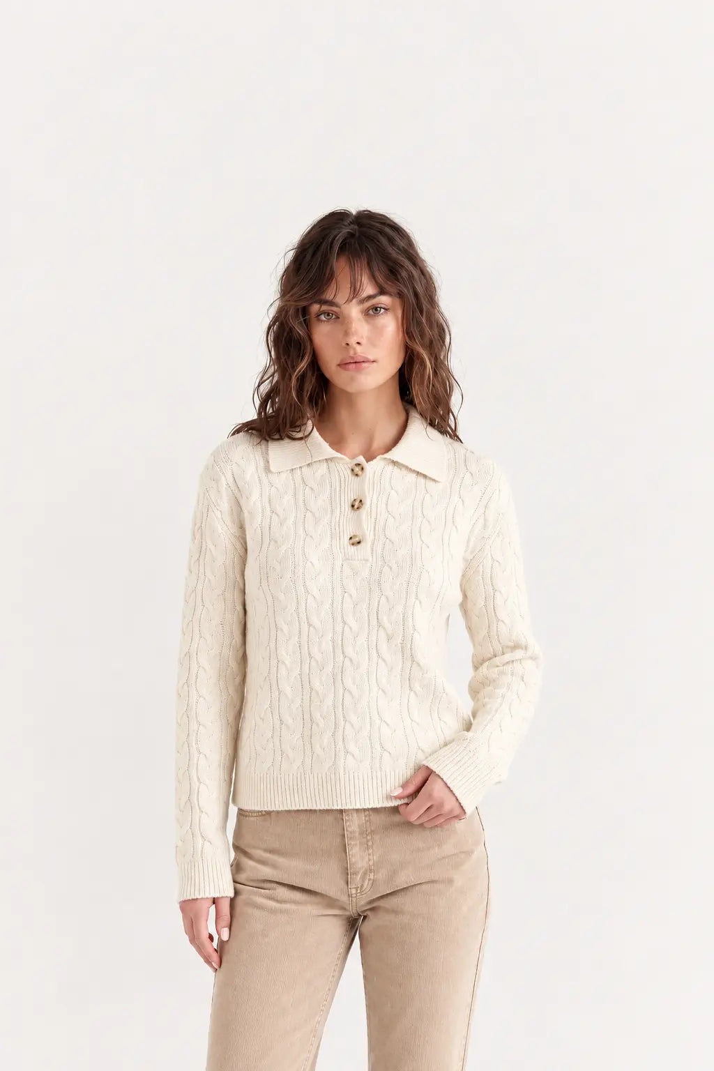 Woman wearing luxury ivory cotton polo jumper styled with tailored trousers - AYRA Store quiet luxury knitwear