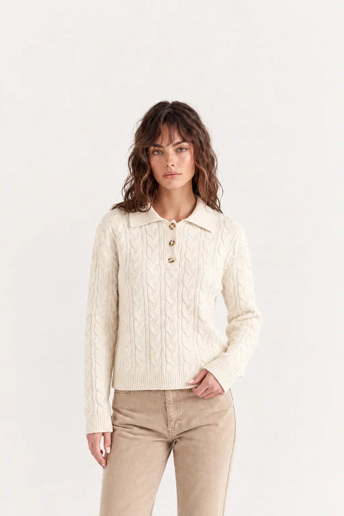 Woman wearing luxury ivory cotton polo jumper styled with tailored trousers - AYRA Store quiet luxury knitwear