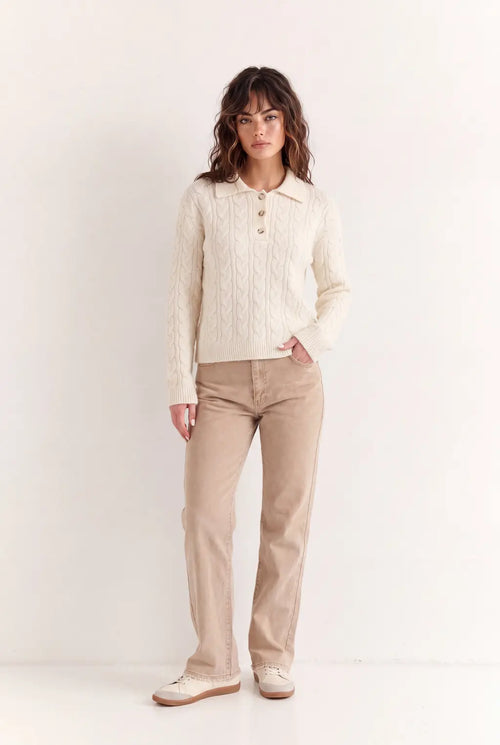 Woman wearing luxury ivory cotton polo jumper styled with tailored trousers - AYRA Store quiet luxury knitwear