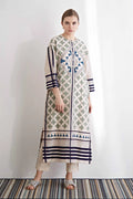 An oversized ivory drop-shoulder kameez featuring blue and green geometric hand-cut appliqué motifs and horizontal striped borders.