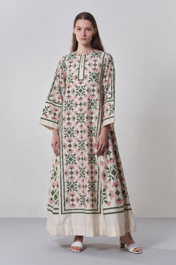 Woman wearing a floral dress with a white background