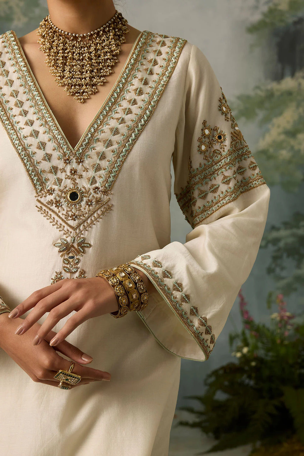 seher-detailed-gold-and-sea-green-aari-embroidery-with-mirror-work-on-ivory-silk-ayra