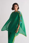 A vibrant green Chanderi shirt featuring blue and lime green geometric hand-cut appliqué and cutwork on the shoulders, paired with matching wide-leg trousers.