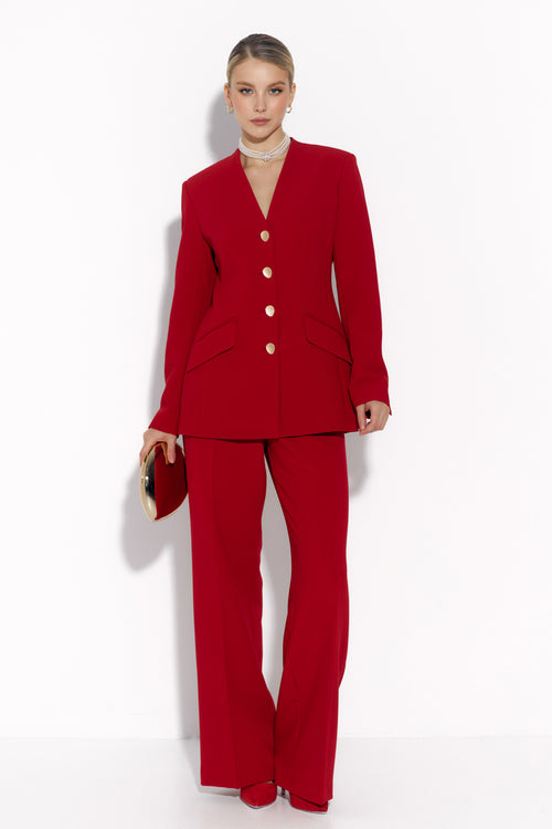 Woman wearing a red suit with a white background