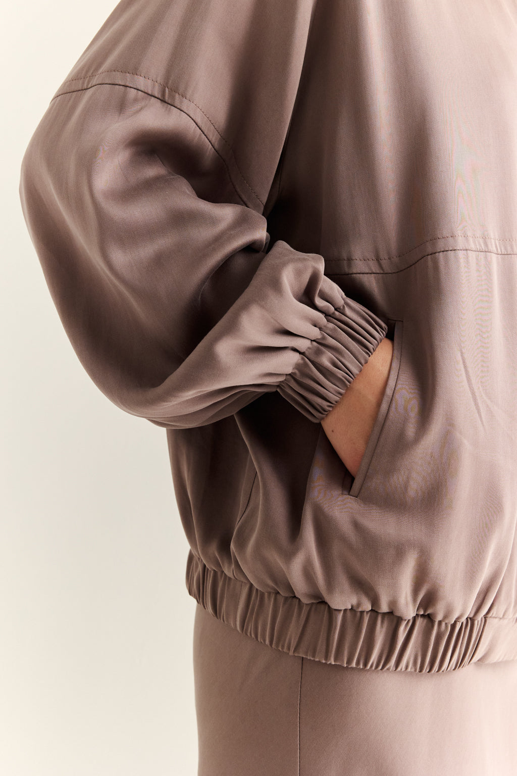 Brown jacket with a neutral background