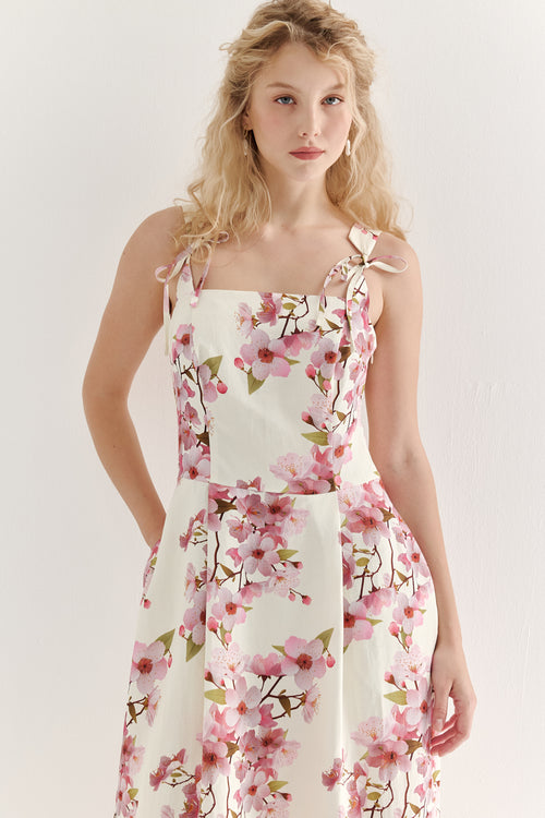 Woman wearing a floral dress on a white background