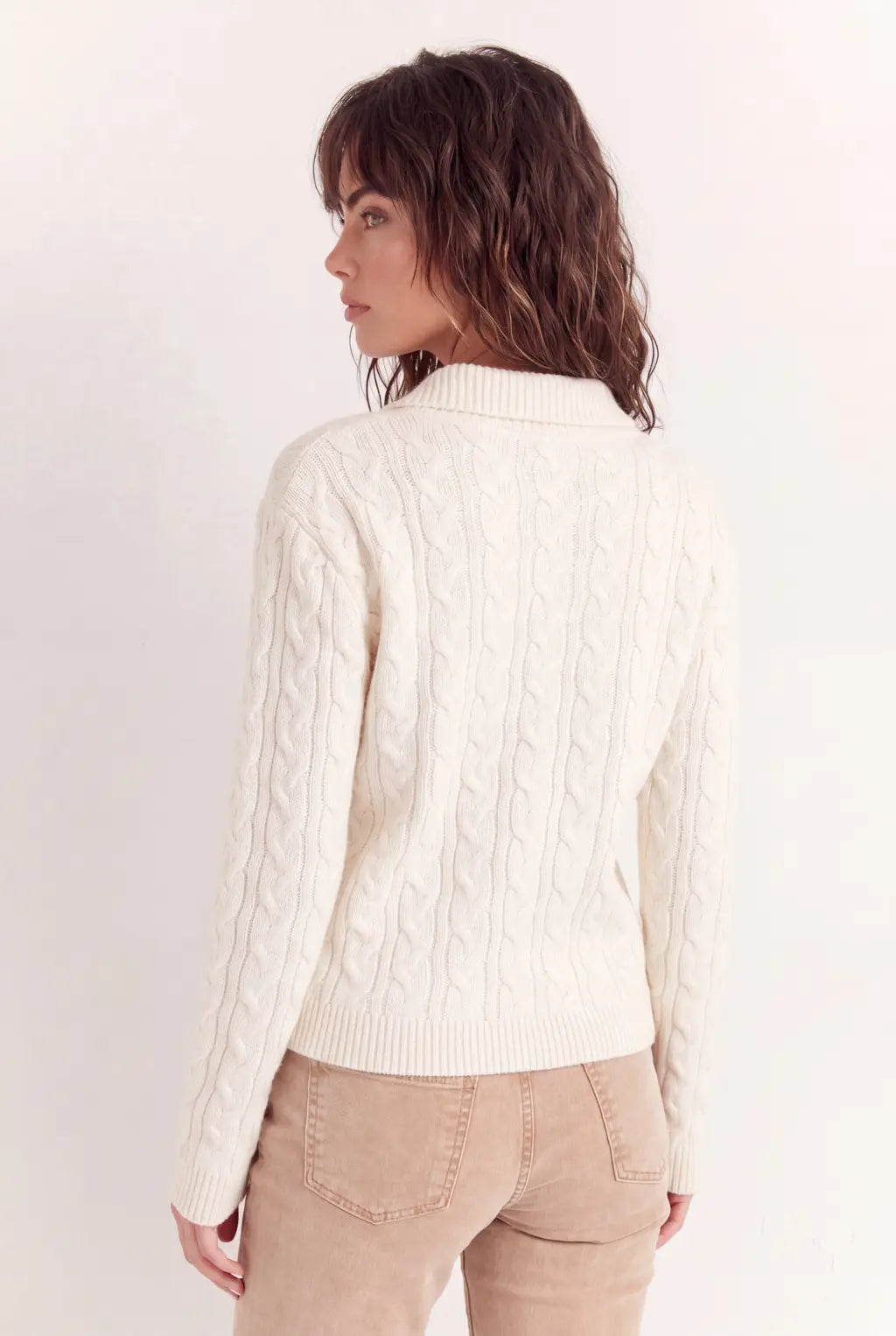 Woman wearing luxury ivory cotton polo jumper styled with tailored trousers - AYRA Store quiet luxury knitwear