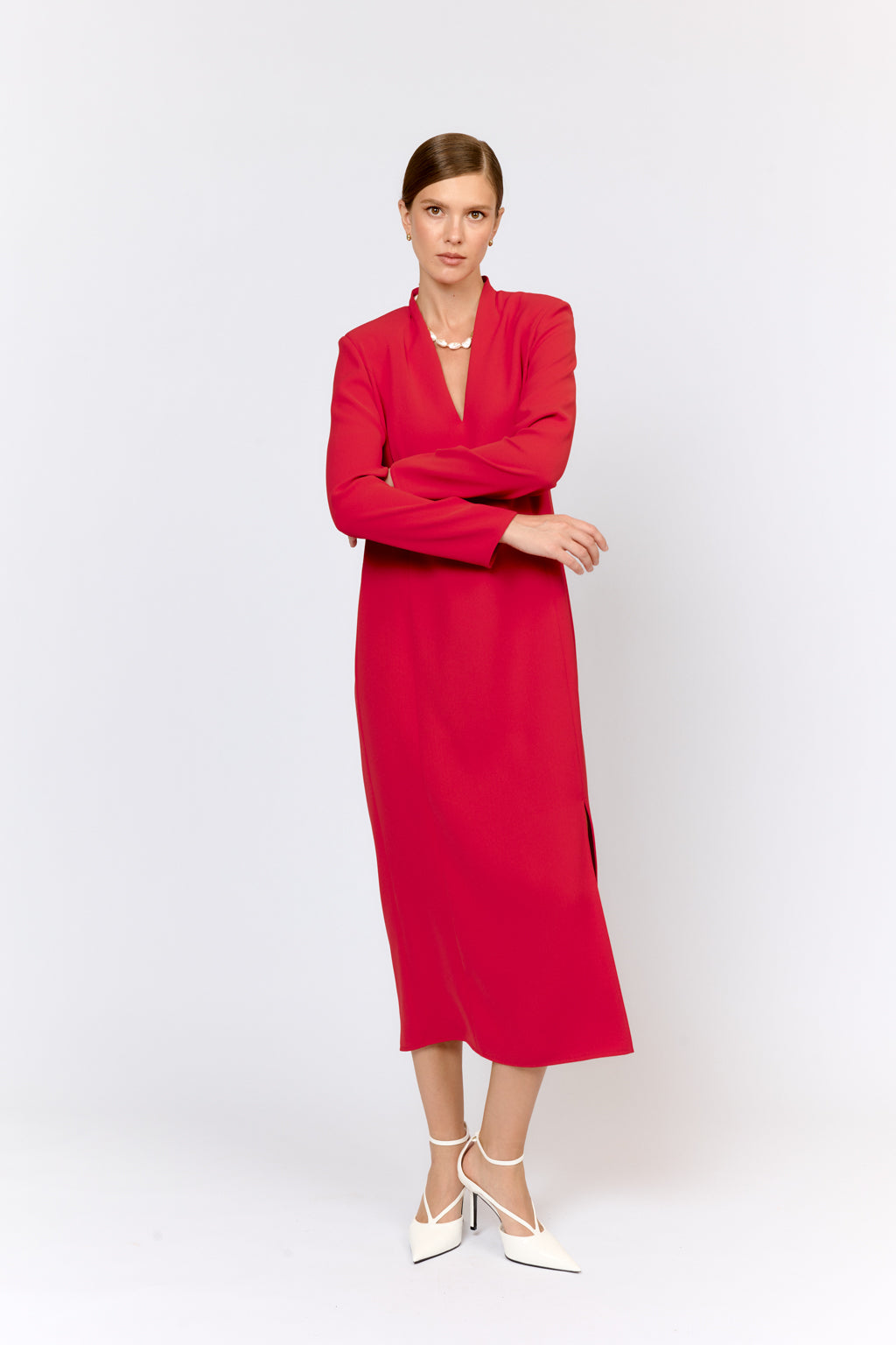 Woman wearing a red dress on a white background