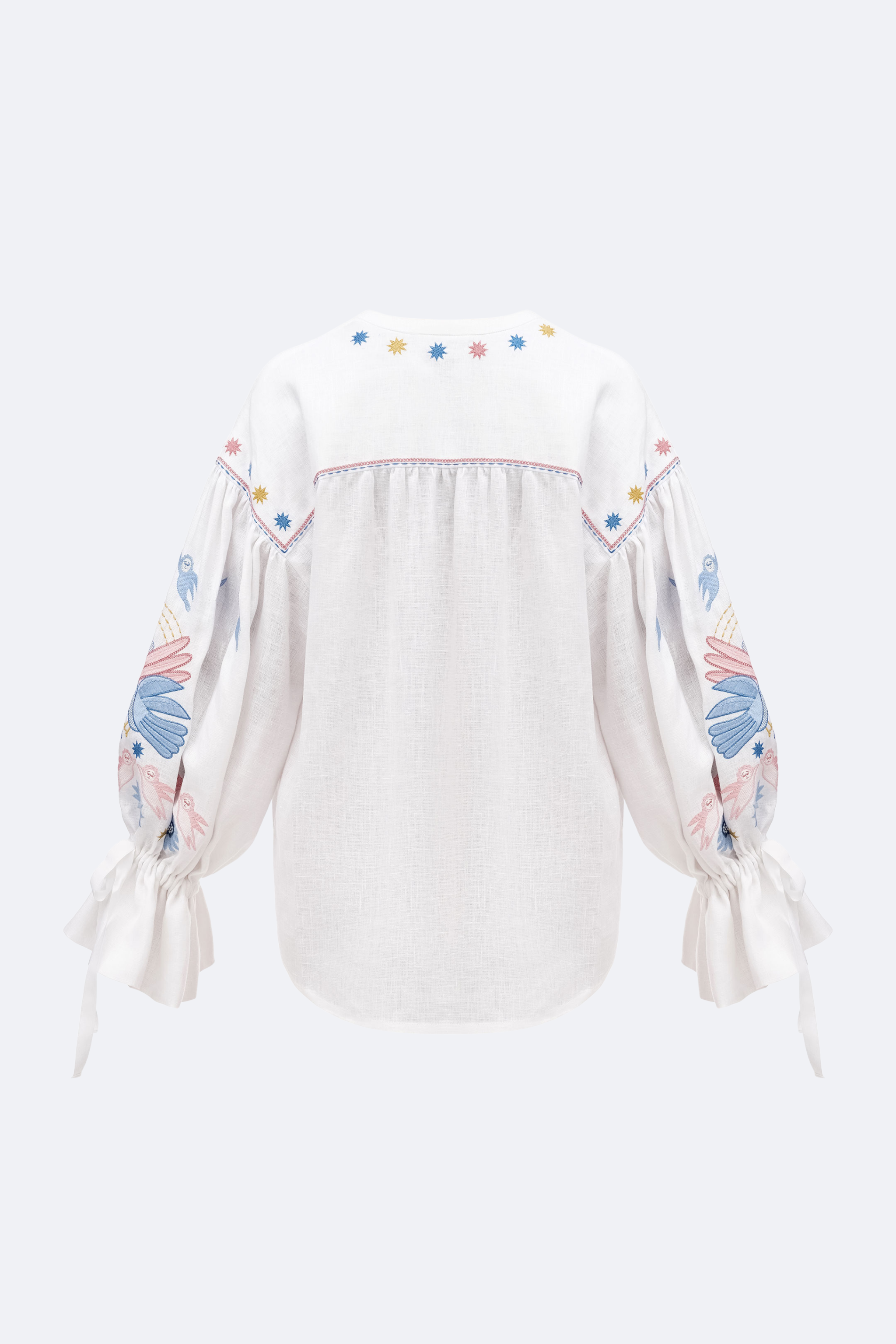White blouse with colorful sleeve designs on a white background