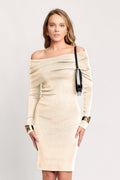 Woman wearing a beige off-shoulder dress with long sleeves on a white background