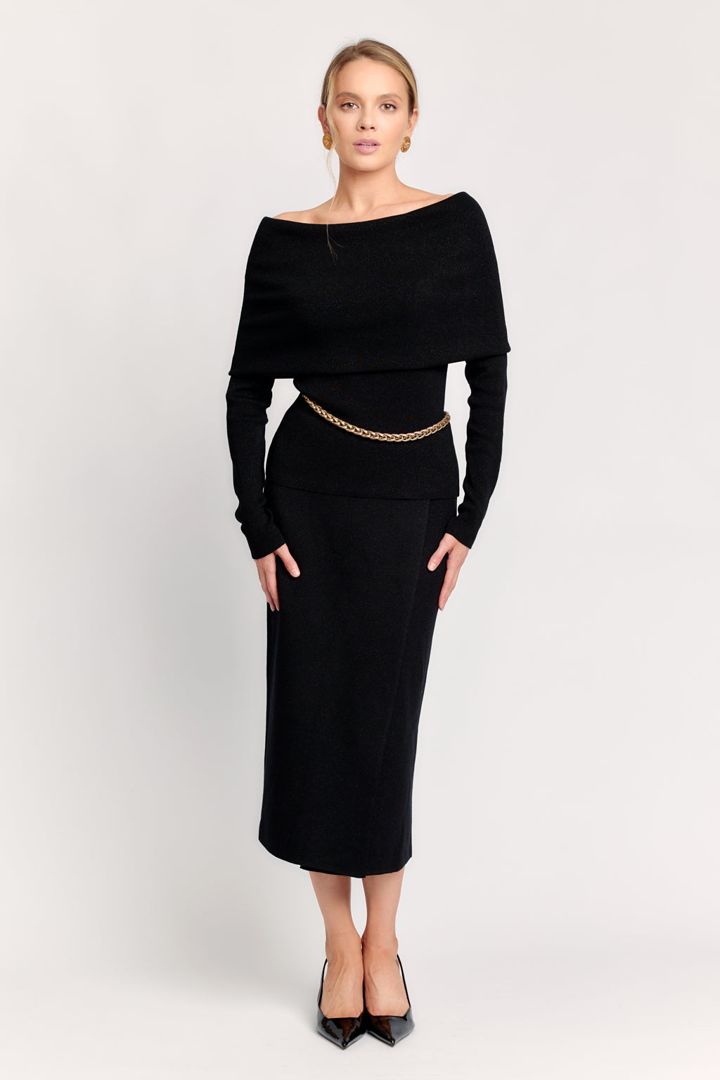 DEITY deep black fitted long-sleeve shirt with an architectural off-the-shoulder neckline.